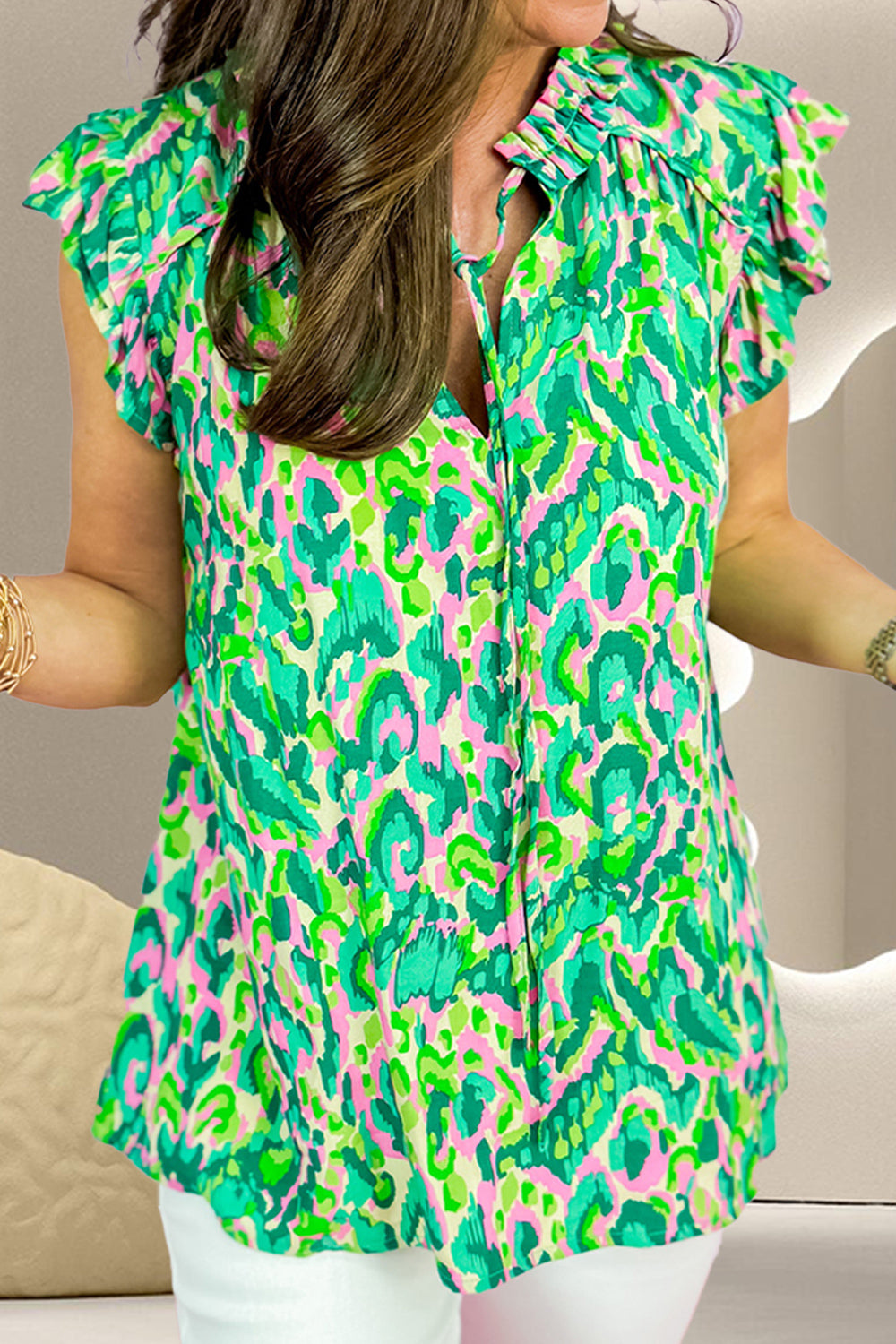 Ruffled Printed Tie Neck Cap Sleeve Blouse